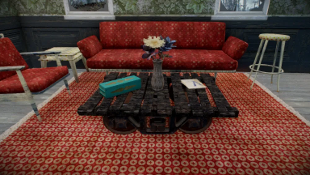 A red patterned sofa, rug and pallet coffee table from V's Stylish Decor